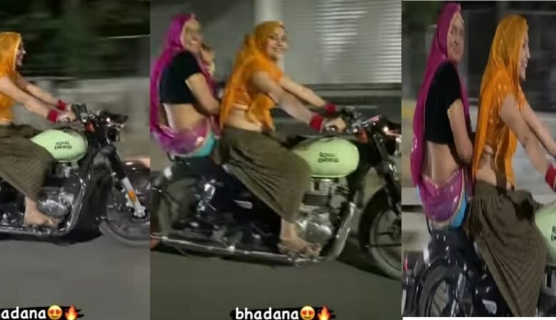 लहंगा पहने हल्के घूंघट और जानदार मुस्कान में सड़क पर Bullet दौड़ा रहीं भाभी बुलेट की स्पीड देखकर लोग हुए भौचक्के देखे वीडियो